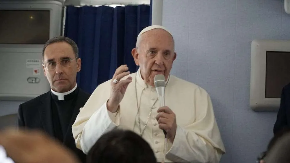 Pope Francis speaks aboard a Nov. 26 flight from Tokyo to Rome. Credit: Hannah Brockhaus/CNA
